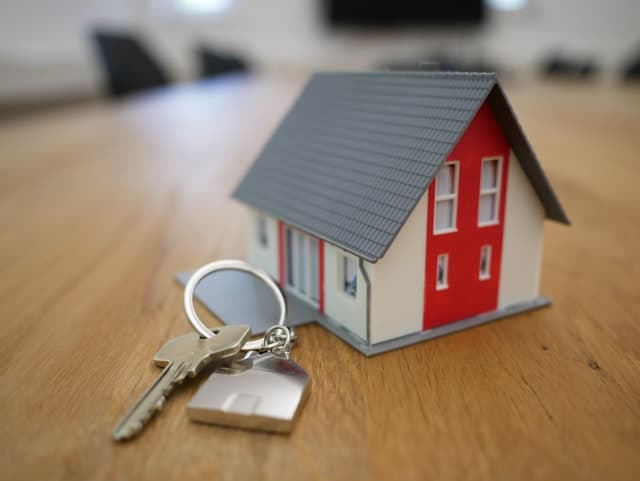 Real estate agent with clients viewing a property